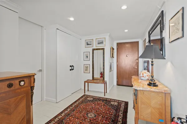 a view of a hallway with seating area
