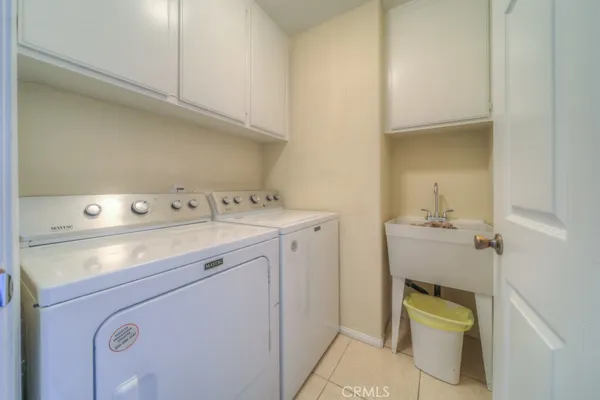 a bedroom with a bed and a chair