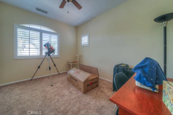 a workspace with furniture and a window