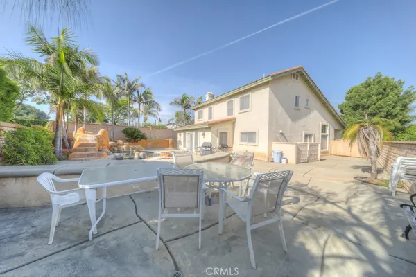 a kitchen with stainless steel appliances kitchen island granite countertop a sink and cabinets
