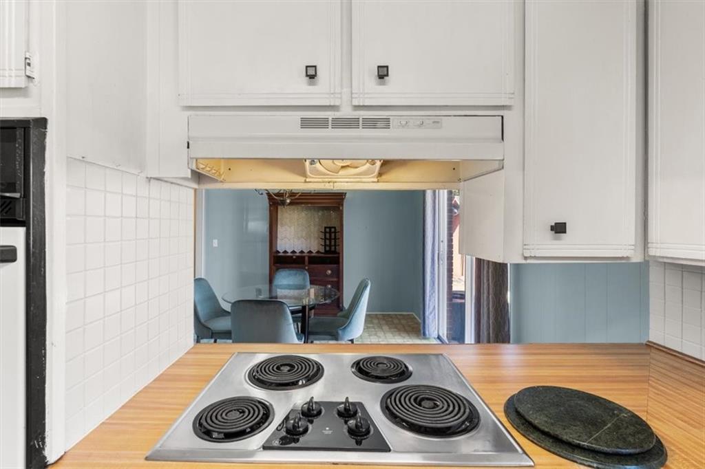 213 Cook Street Cartersville, GA 30120 - Photo 12 of 45 a kitchen with a stove and wooden floor