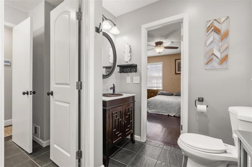 213 Cook Street Cartersville, GA 30120 - Photo 23 of 45 a bathroom with a sink a toilet and shower