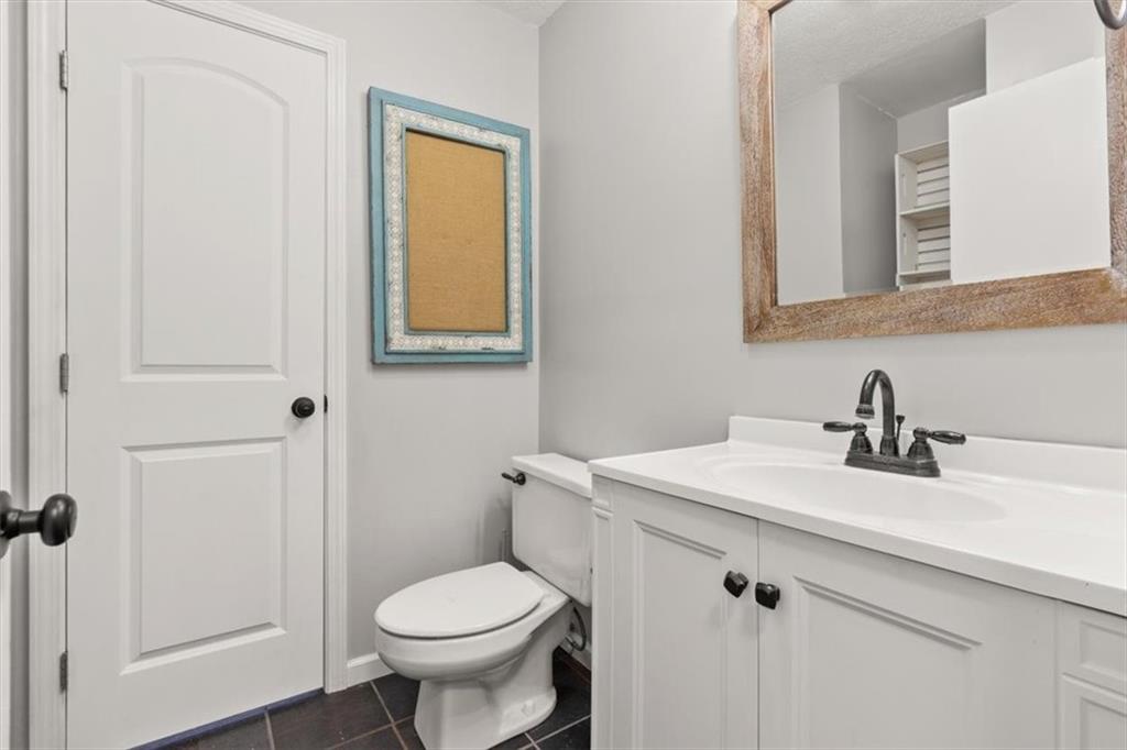 213 Cook Street Cartersville, GA 30120 - Photo 24 of 45 a bathroom with a sink toilet and a mirror