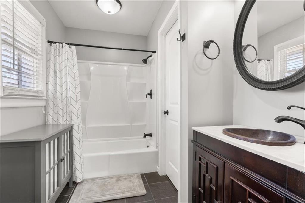 213 Cook Street Cartersville, GA 30120 - Photo 25 of 45 a bathroom with a sink a toilet and a bathtub