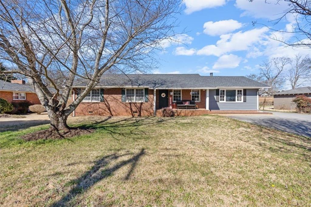 213 Cook Street Cartersville, GA 30120 - Photo 28 of 45 a view of a house with a yard