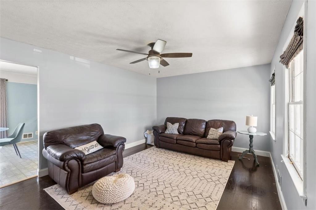 213 Cook Street Cartersville, GA 30120 - Photo 3 of 45 a living room with furniture and a rug