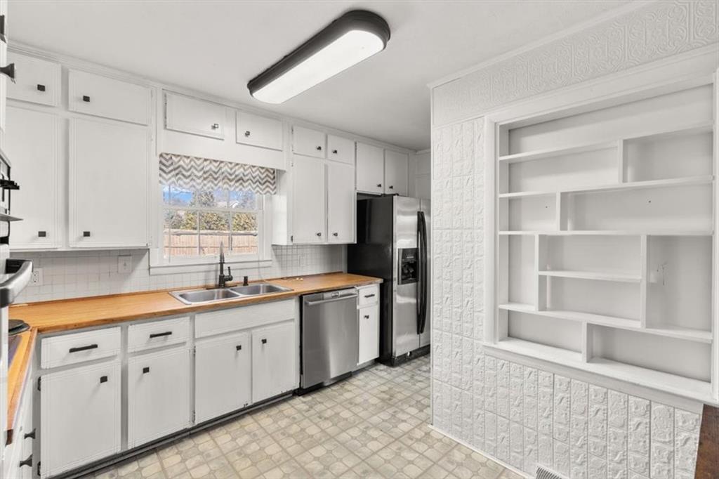 213 Cook Street Cartersville, GA 30120 - Photo 8 of 45 a kitchen with a sink stove and cabinets