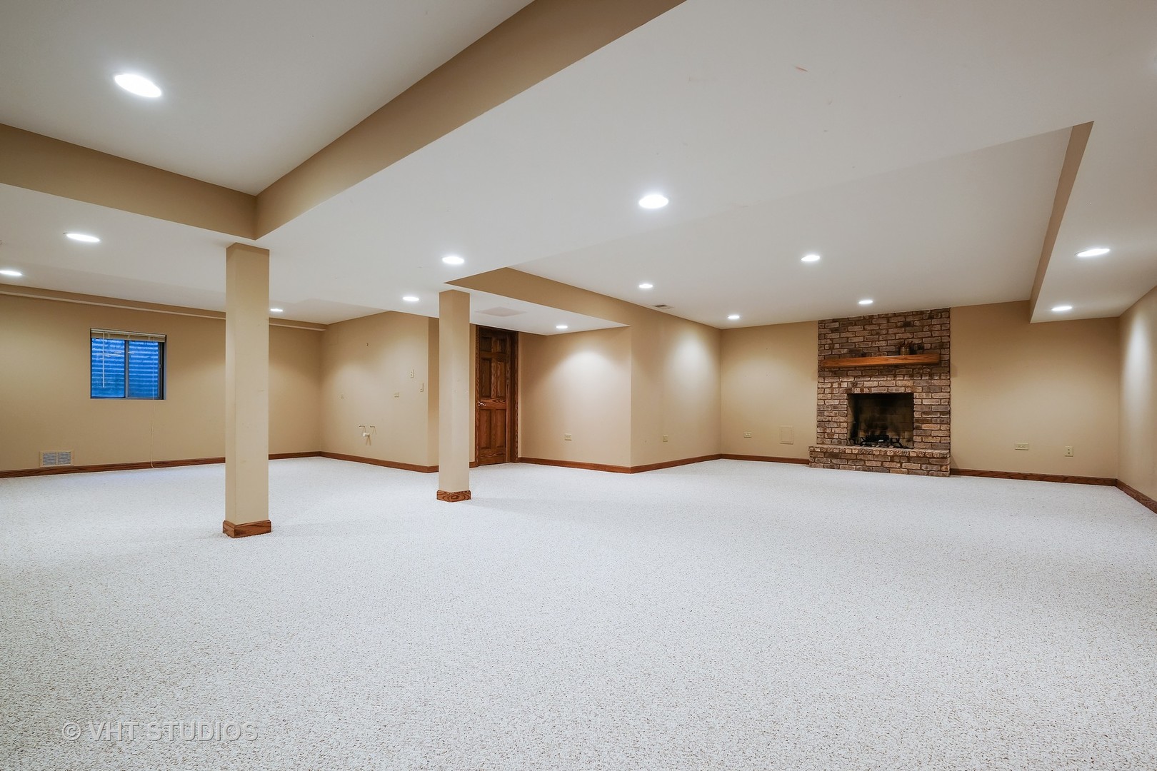 4 Bristol Road Northfield, IL 60093 - Photo 15 of 22 a view of an empty room with a fireplace