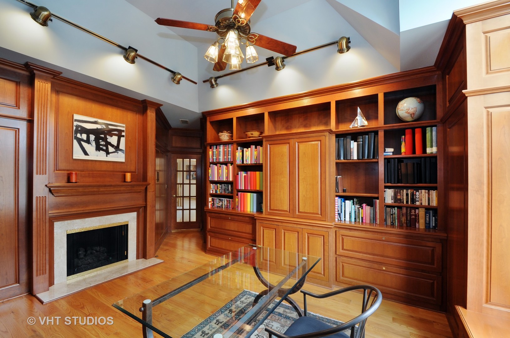 4 Bristol Road Northfield, IL 60093 - Photo 6 of 22 a living room with furniture a flat screen tv and a book shelf