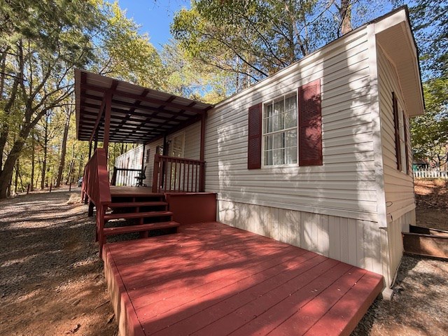 193 Mt Pisgah Drive Ellijay, GA 30540 - Photo 2 of 13 a backyard of a house with barbeque oven and table and chairs