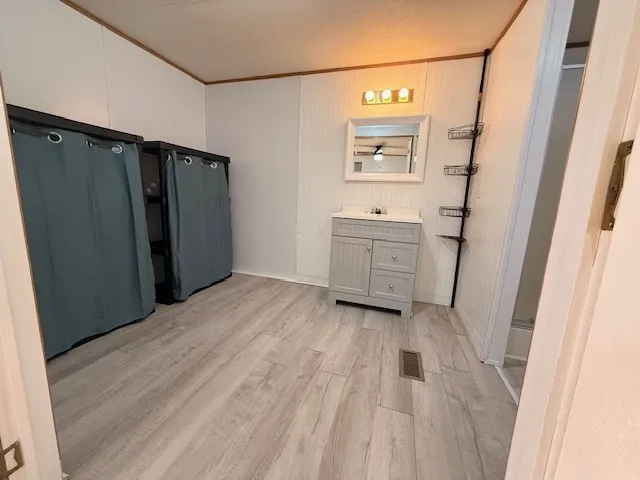 a view of a bathroom with a sink and a mirror