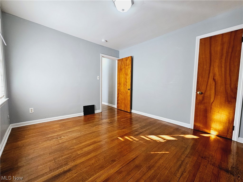 884 Yellowstone Road Cleveland Heights, OH 44121 - Photo 11 of 17 Unfurnished first floor bedroom room with dark hardwood / wood-style floors