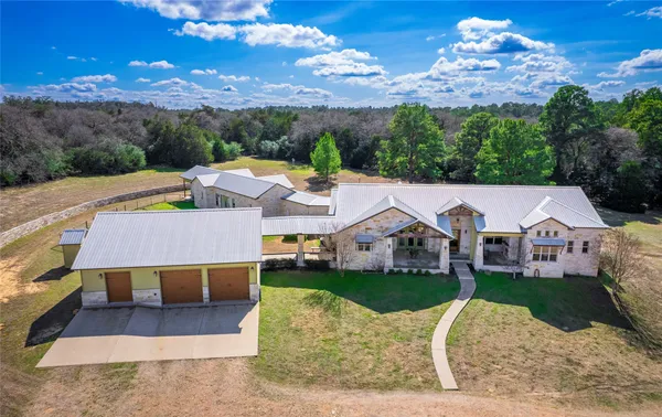 a view of a house with a yard porch and sitting area