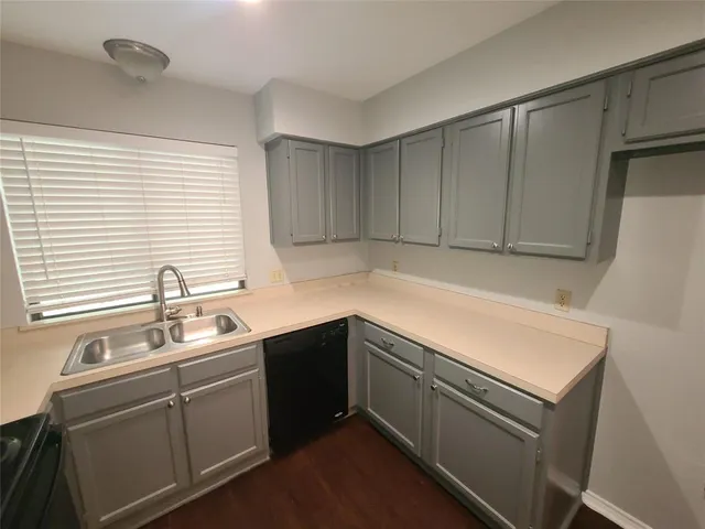 a an empty room with a fireplace and a window