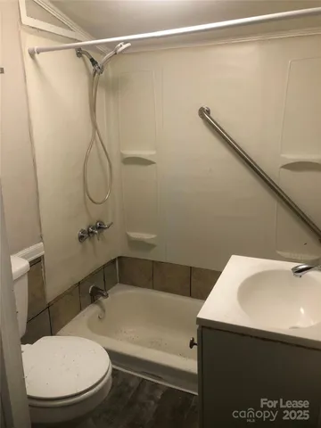 a bathroom with a sink and toilet