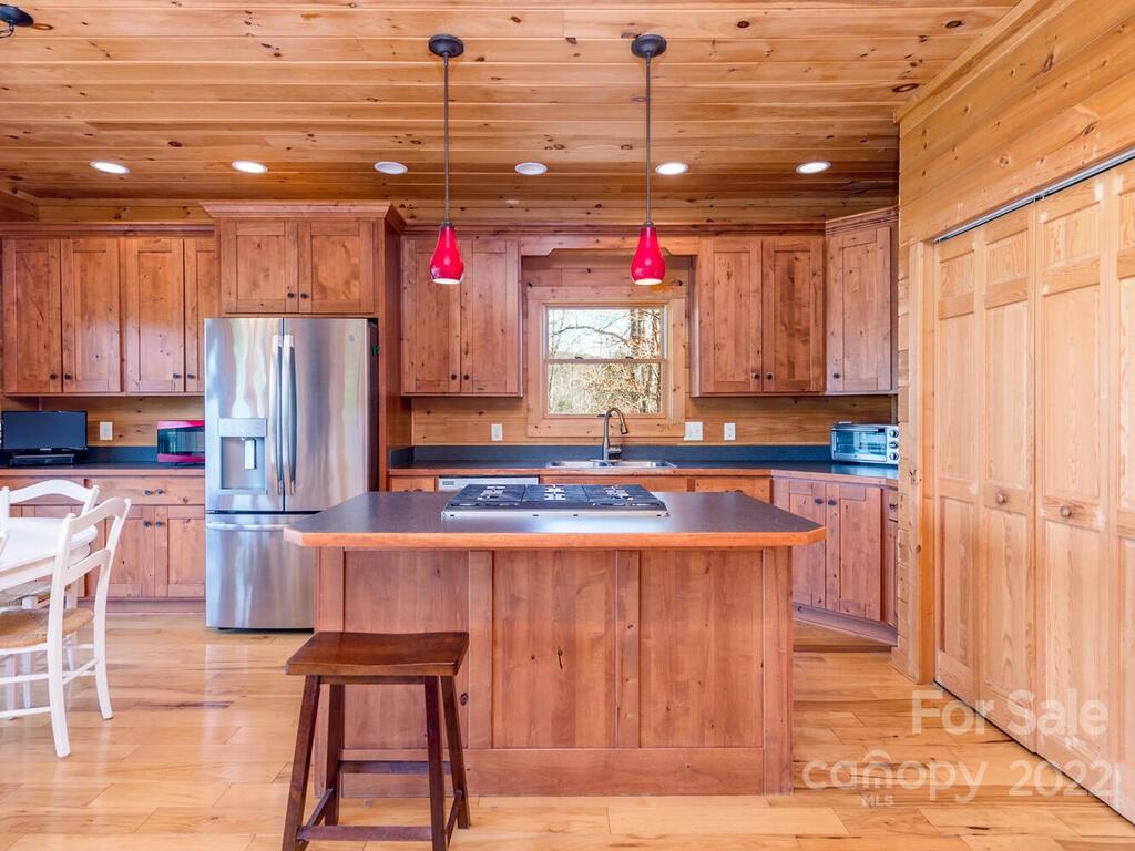 206 Legend Dr Mill Spring, Unit 8 Mill Spring, NC 28756 - Photo 20 of 47 a kitchen with stainless steel appliances granite countertop a refrigerator and a stove