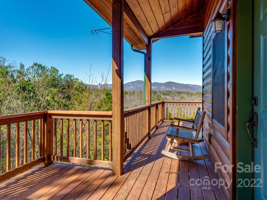 206 Legend Dr Mill Spring, Unit 8 Mill Spring, NC 28756 - Photo 2 of 47 a view of balcony with wooden floor and fence