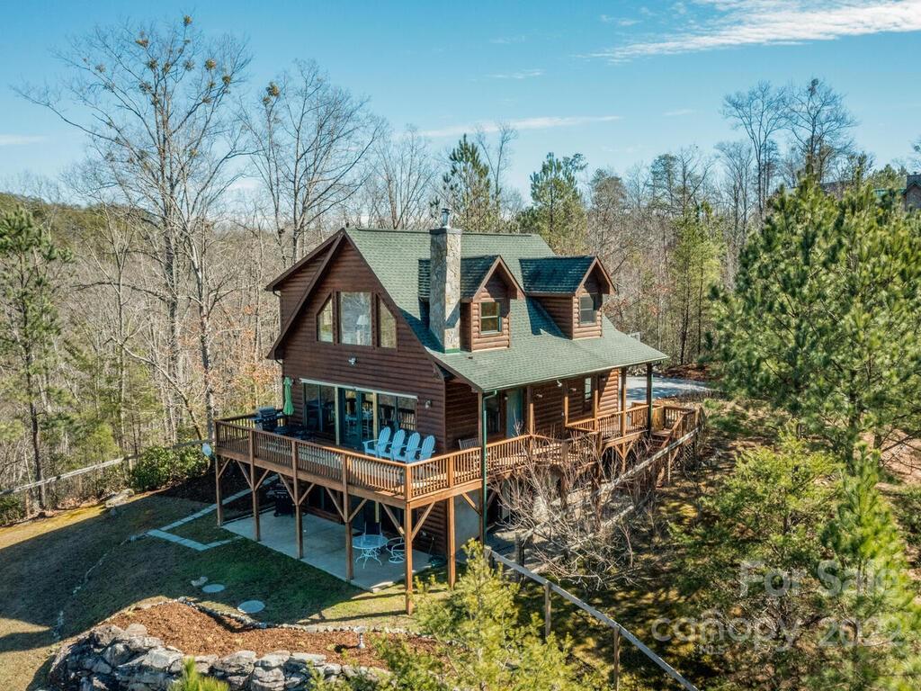 206 Legend Dr Mill Spring, Unit 8 Mill Spring, NC 28756 - Photo 44 of 47 a aerial view of a house with a yard table and chairs