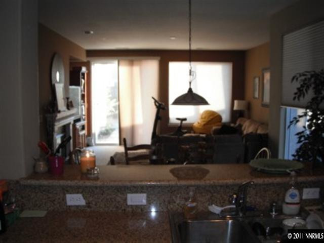 13755 Seabiscuit Drive Reno, NV 89521 - Photo 5 of 12 a room with lots of potted plants