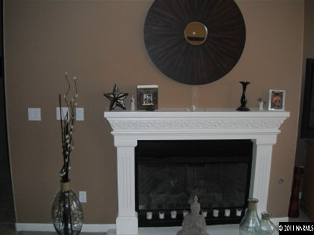 13755 Seabiscuit Drive Reno, NV 89521 - Photo 7 of 12 a close view of a fireplace with wooden floor