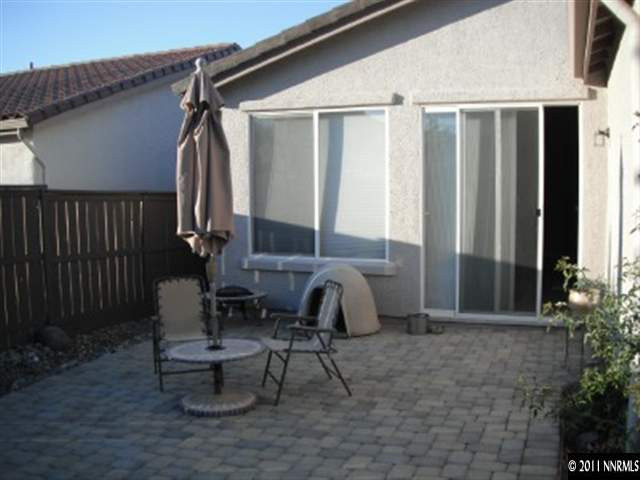 13755 Seabiscuit Drive Reno, NV 89521 - Photo 10 of 12 a view of a back yard from a patio