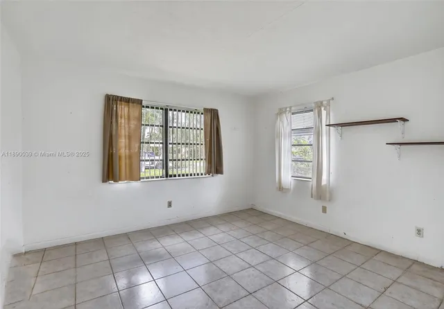 an empty room with windows