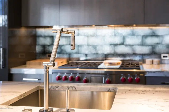 a kitchen with lots of white cabinets