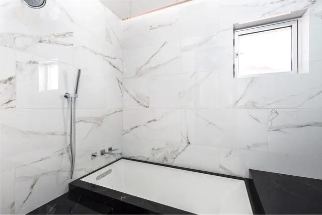 a view of a hallway with a living room