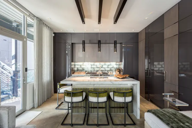 a view of a dining room with furniture and window