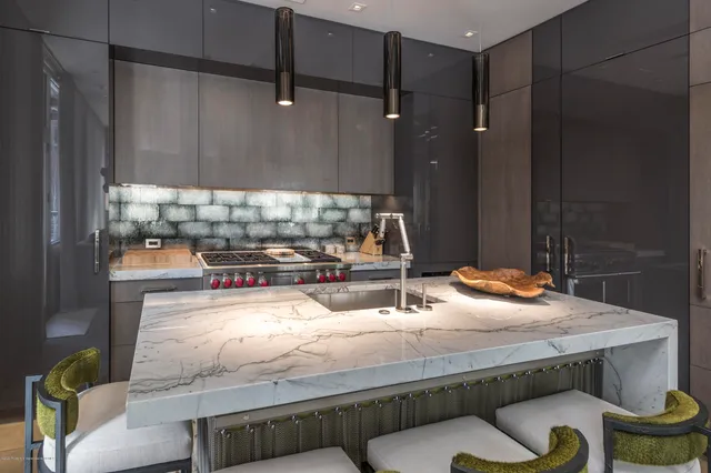 a room with two chairs and a stove