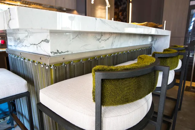 a balcony with table and chairs