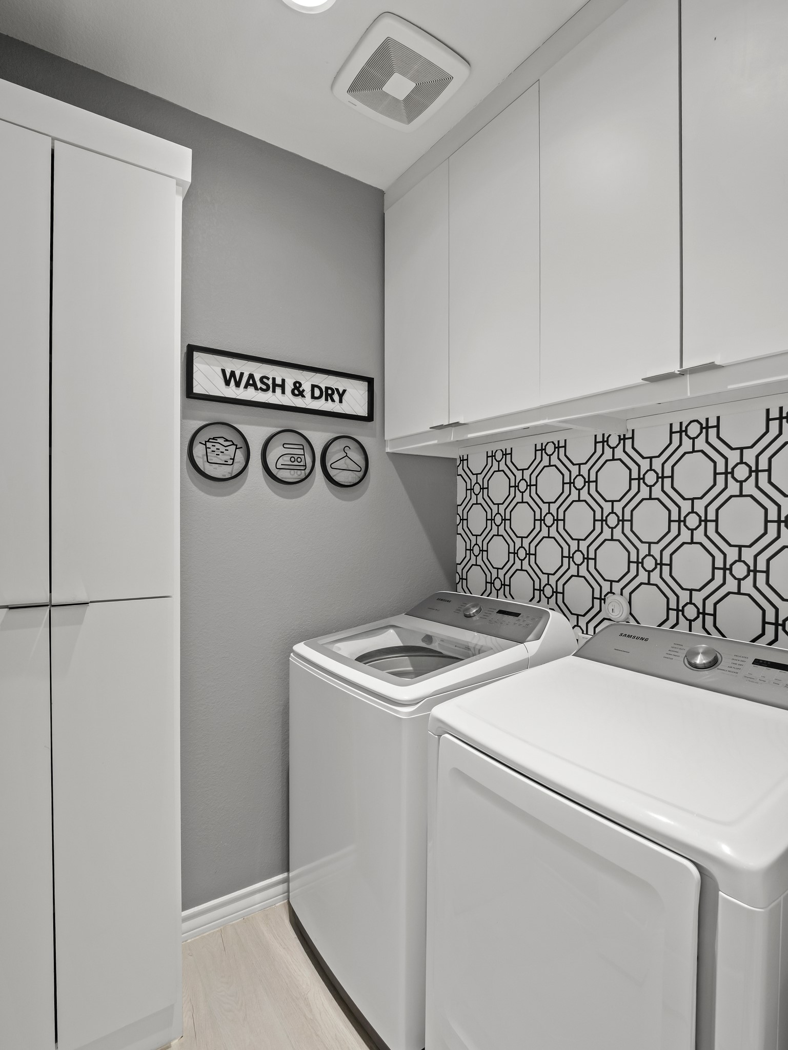 353 Capstone Road Liberty Hill, TX 78642 - Photo 15 of 28 Streamlined laundry area featuring efficient appliances and practical storage solutions.