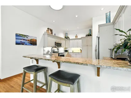 a spacious bedroom with a bed and a large window