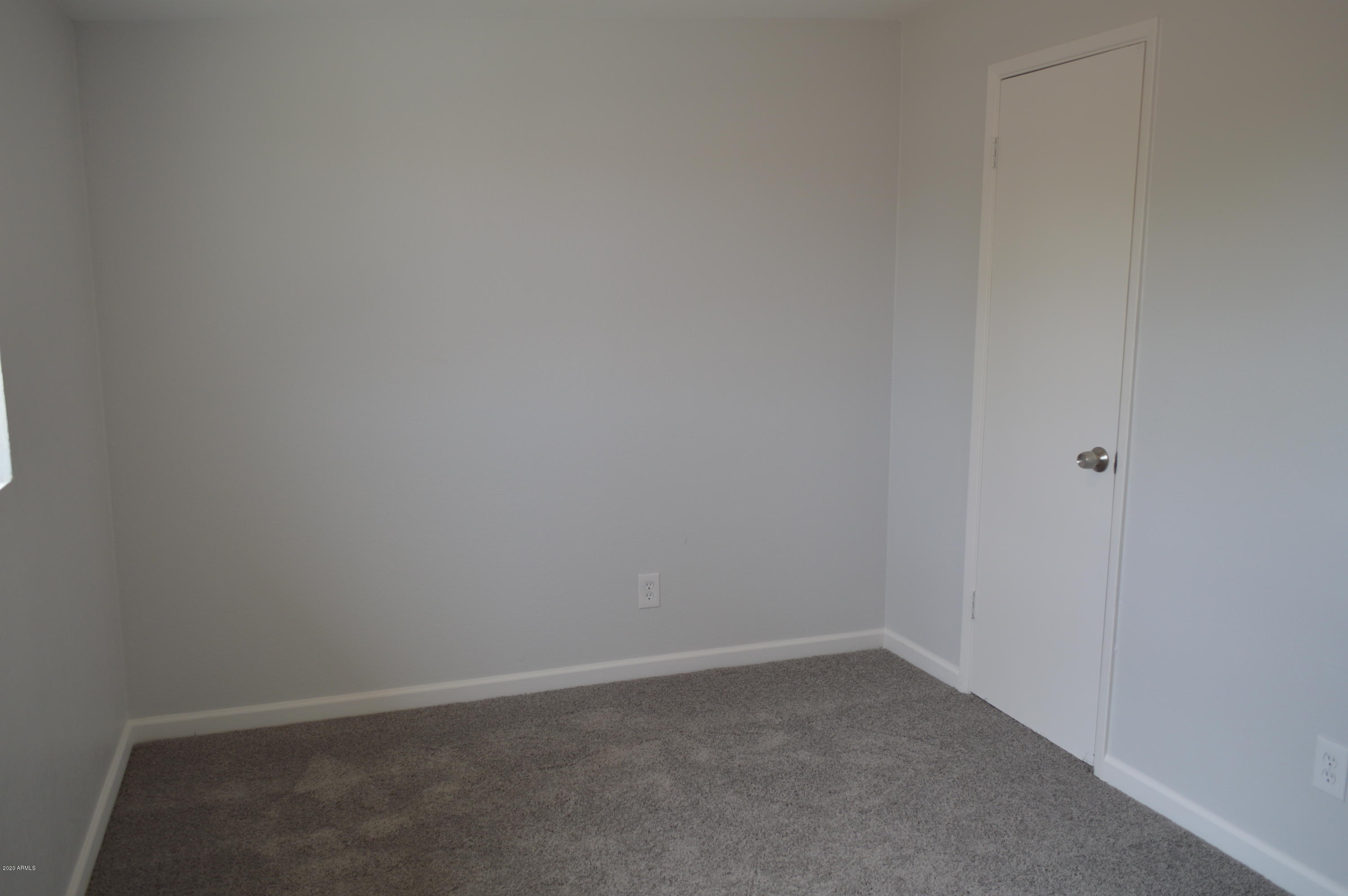 8102 West Osborn Road Phoenix, AZ 85033 - Photo 16 of 21 a room that has a window