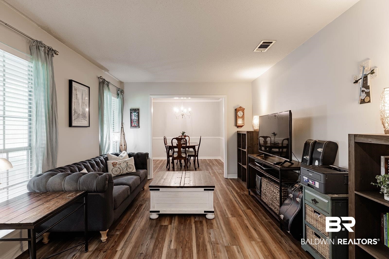 2920 Quail Creek Run Mobile, AL 36695 - Photo 5 of 33 Living room with wood finished floors and a chandelier