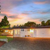 a view of a lake with a house in the background