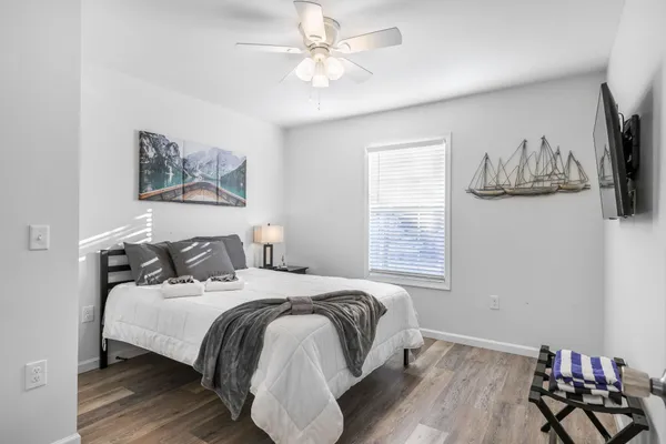 a bedroom with bed and a window