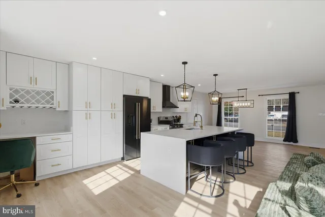 a view of a dining room with furniture and chandelier