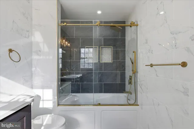 a bathroom with a shower and a sink