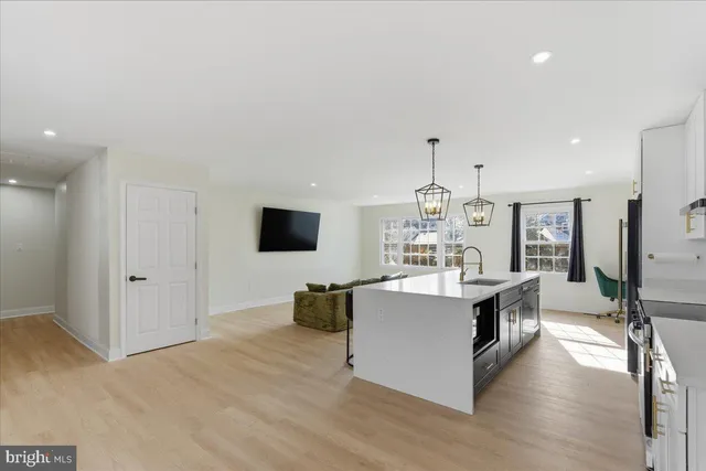 a living room with fireplace furniture and a flat screen tv
