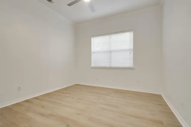 a spacious bathroom with a tub shower sink and mirror