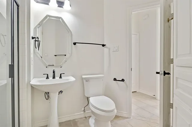 a view of a backyard with a small cabin and a chair