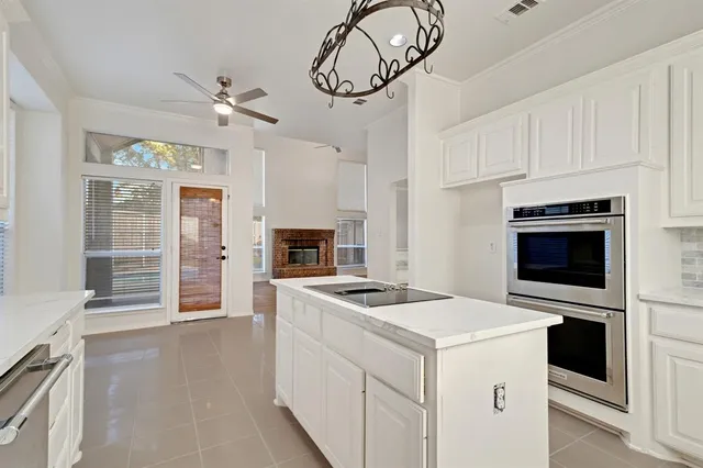 a kitchen with cabinets and appliances