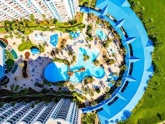 a swimming pool with outdoor seating and yard