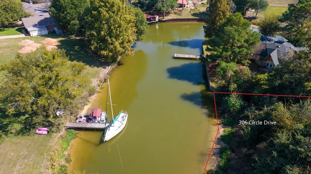306 Circle Ranch Road Trinidad, TX 75163 - Photo 7 of 8 a view of a lake with a house
