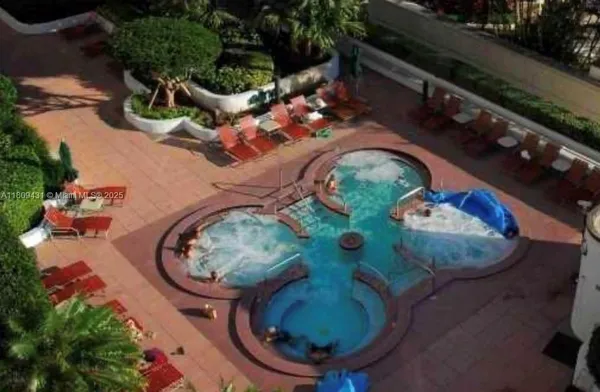 an aerial view of a backyard with outdoor seating