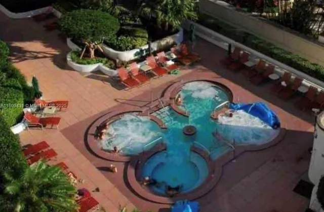 an aerial view of a backyard with outdoor seating
