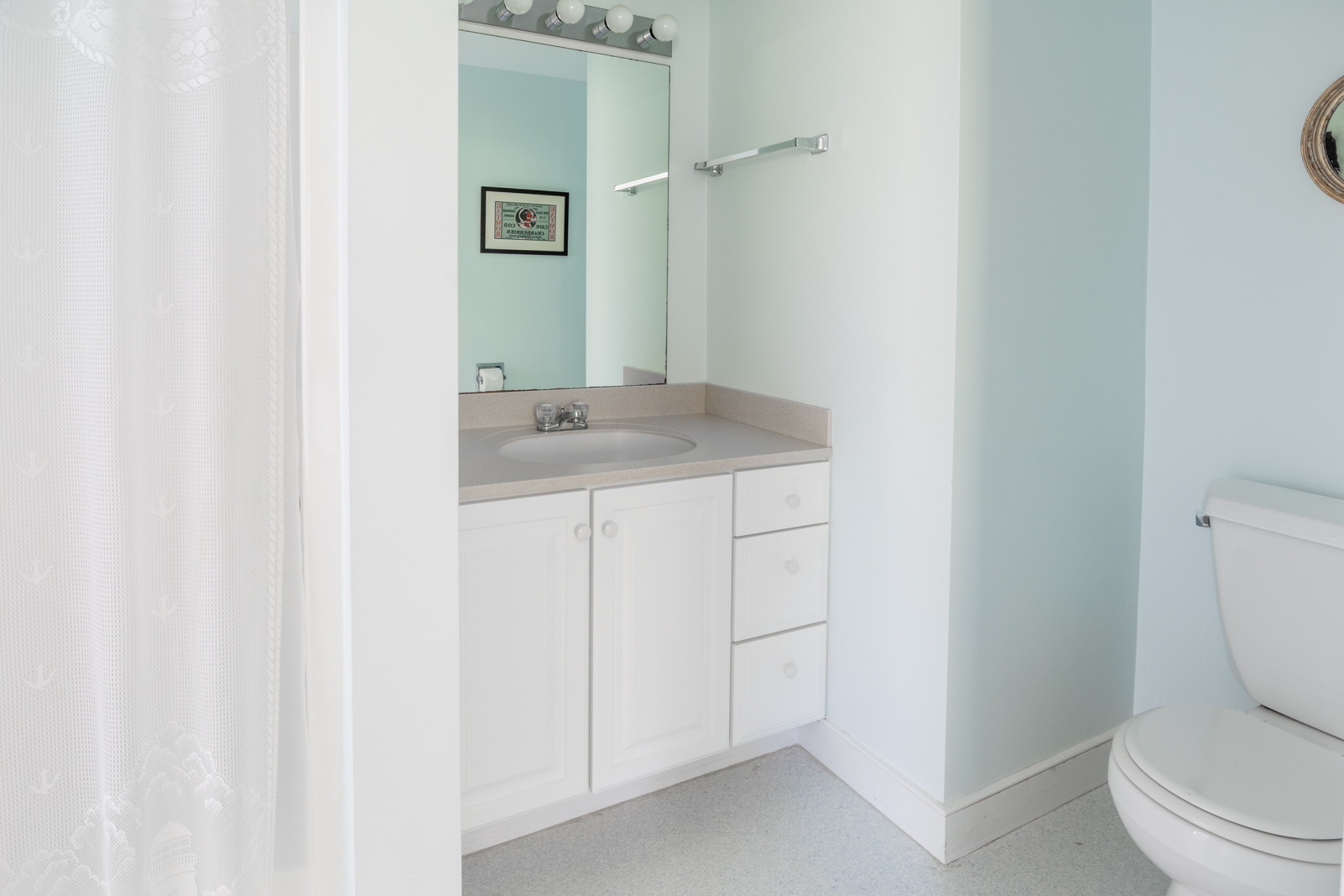 15 Swift Rock Road Nantucket, MA 02554 - Photo 21 of 32 a bathroom with a granite countertop sink and a toilet