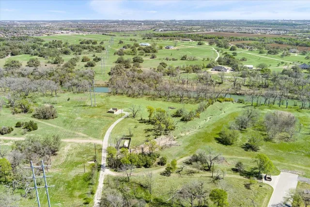 a view of grassy field with mountain