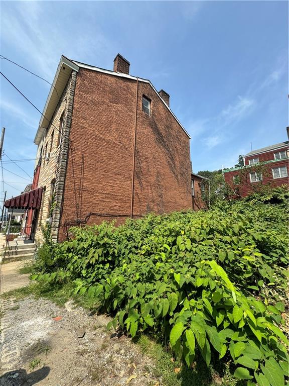 26 Alpine Avenue Pittsburgh, PA 15212 - Photo 15 of 15 a tall brick building with a yard